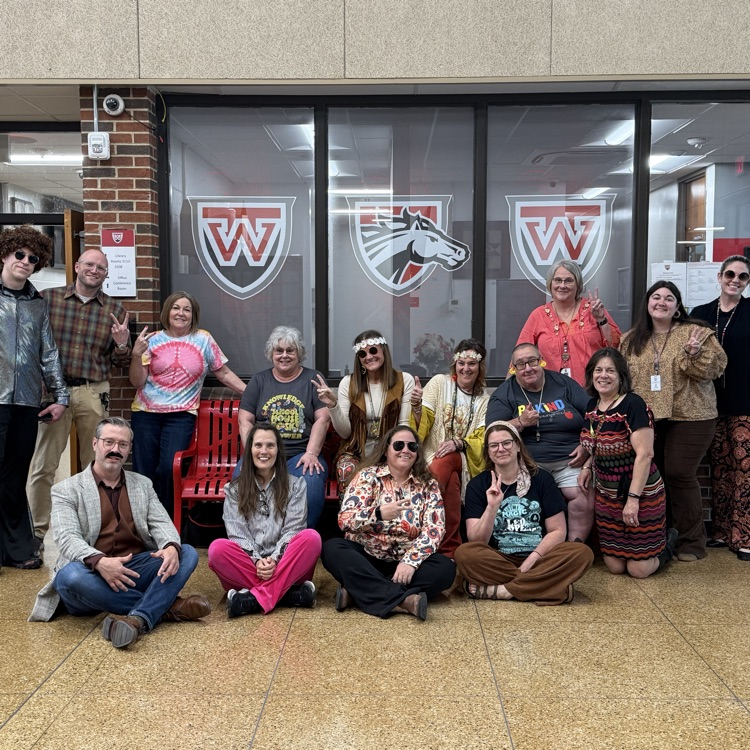 teachers dressed in 70s style clothing