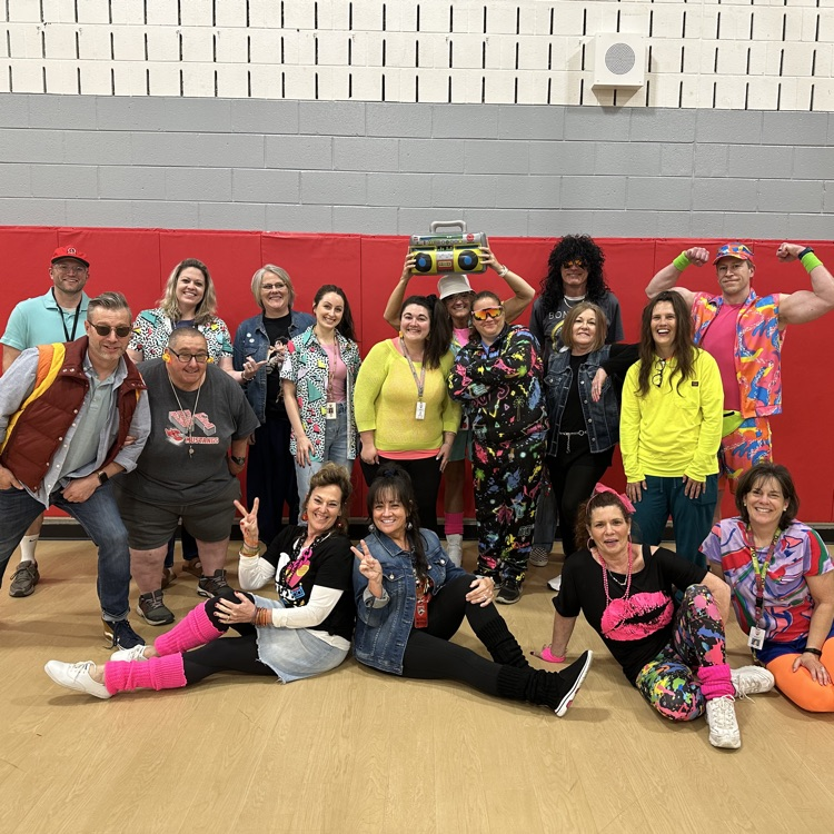 staff members dressed up in 80s era clothing