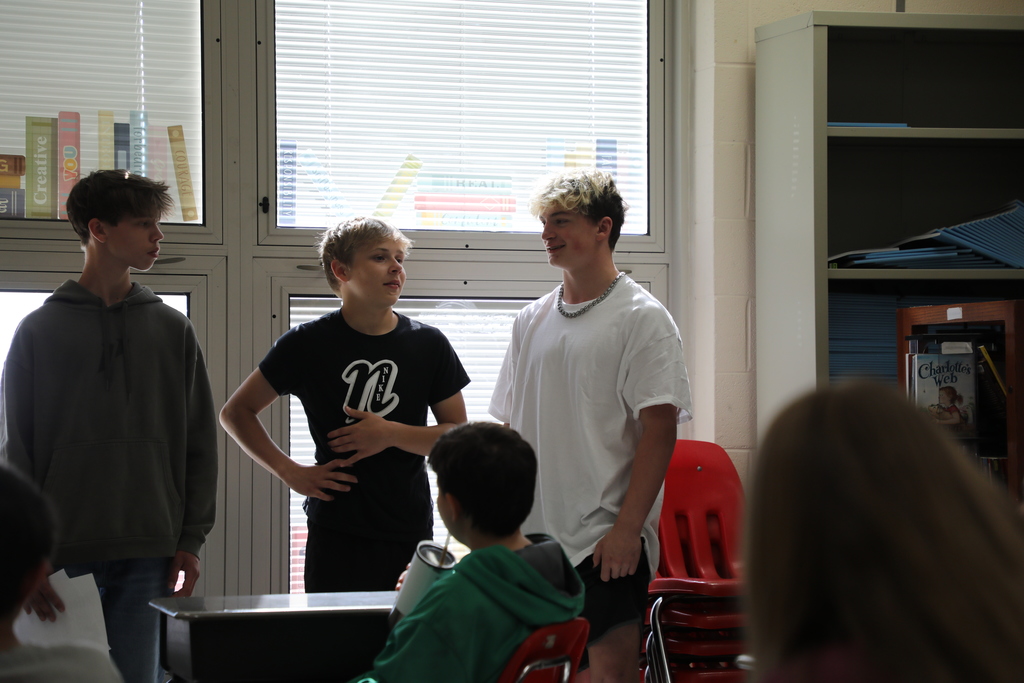 Students standing in front of class