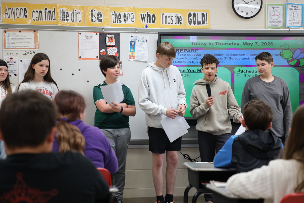 Students standing in front of class