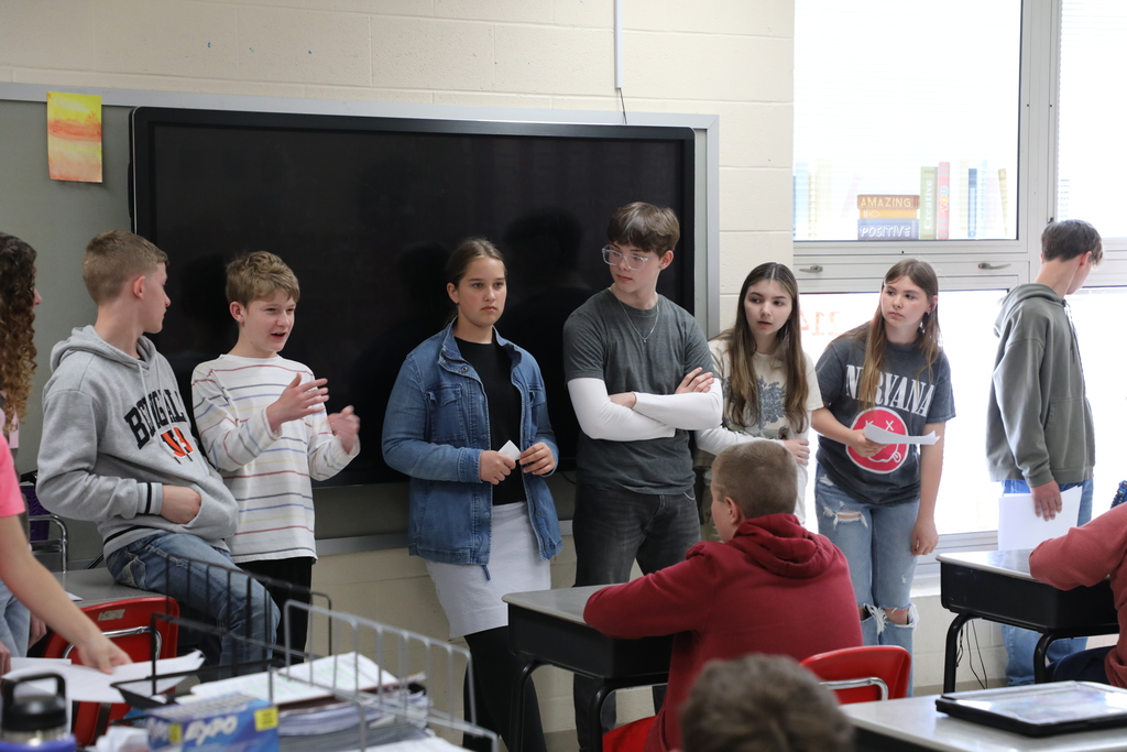 Students standing in front of class