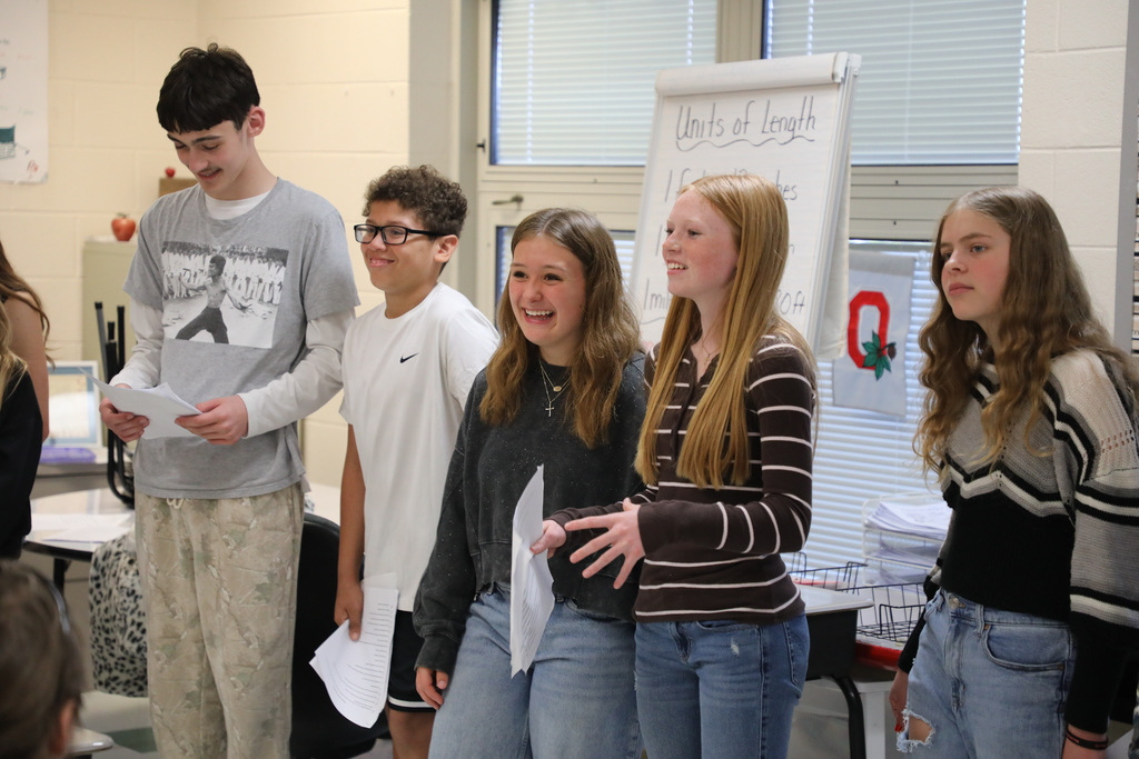 Students standing in front of class