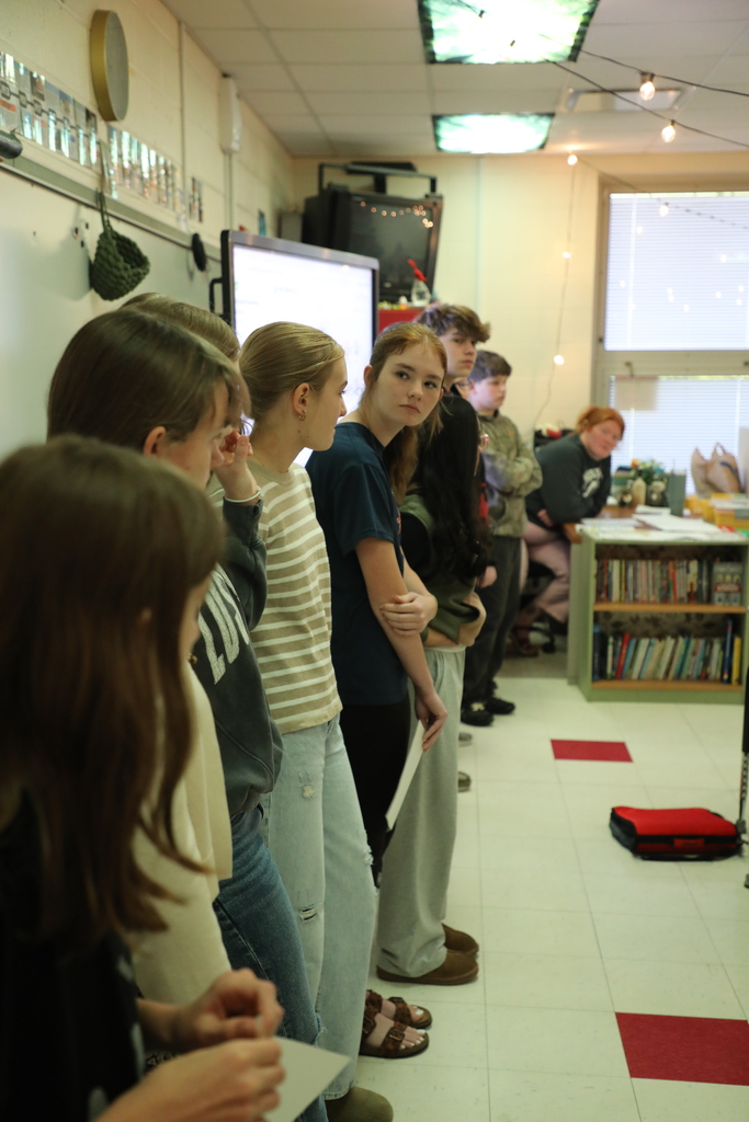 Students standing in front of class