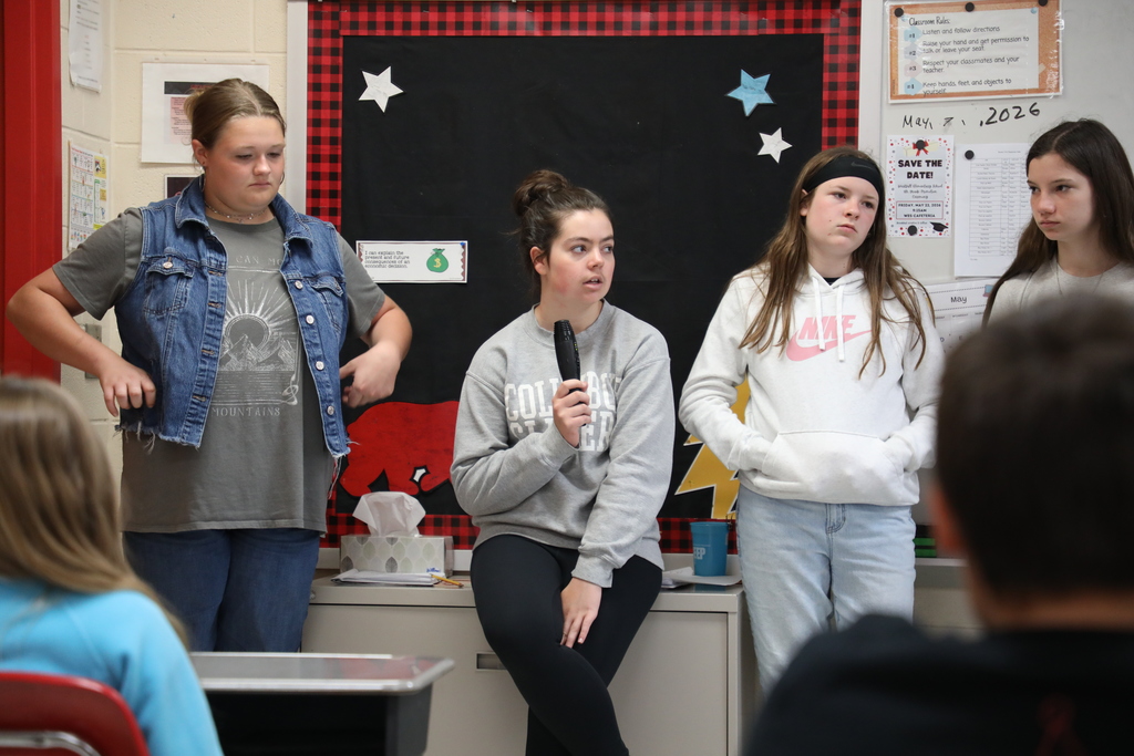 Students standing in front of class