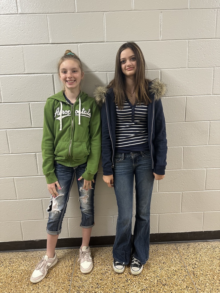 Two students standing next to each other