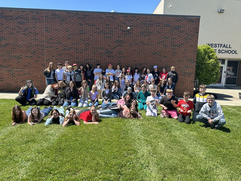 Students gathered together outside in front of Westfall Middle School building