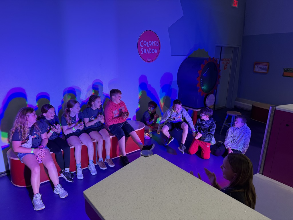 Students enjoying COSI exhibits