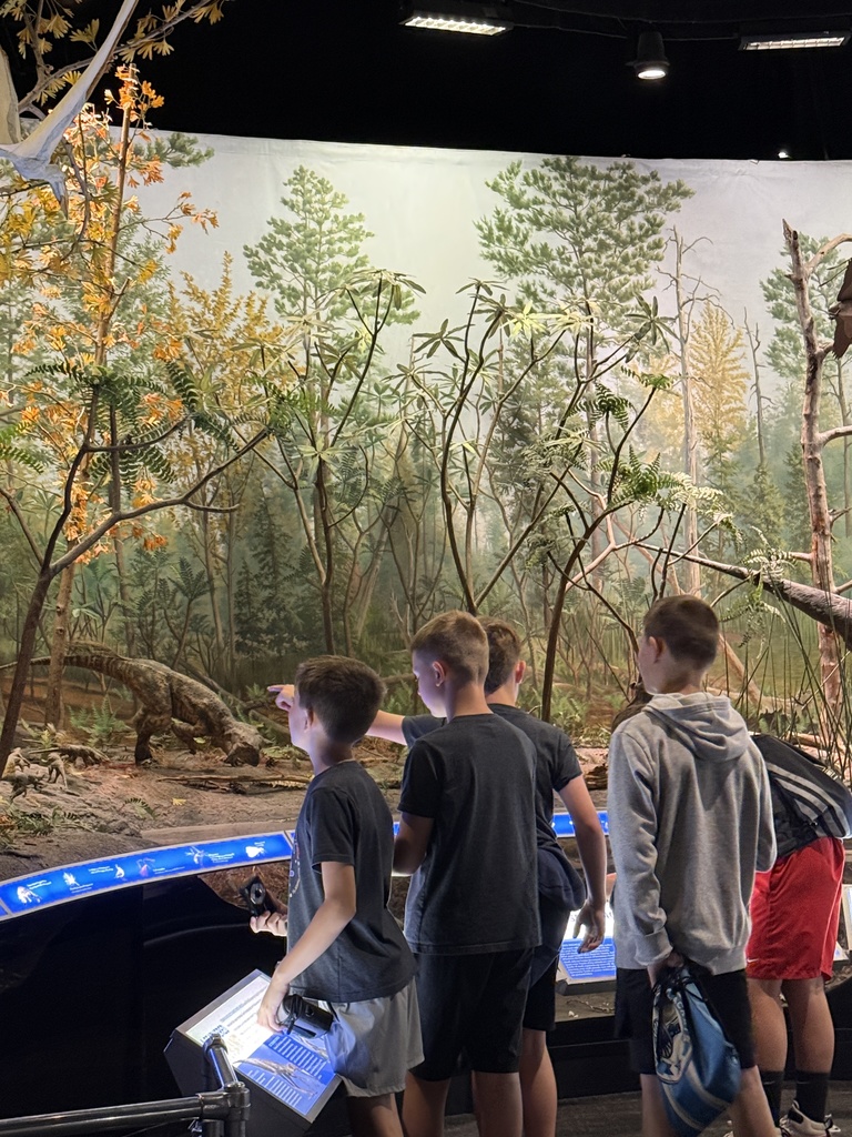 Students enjoying COSI exhibits