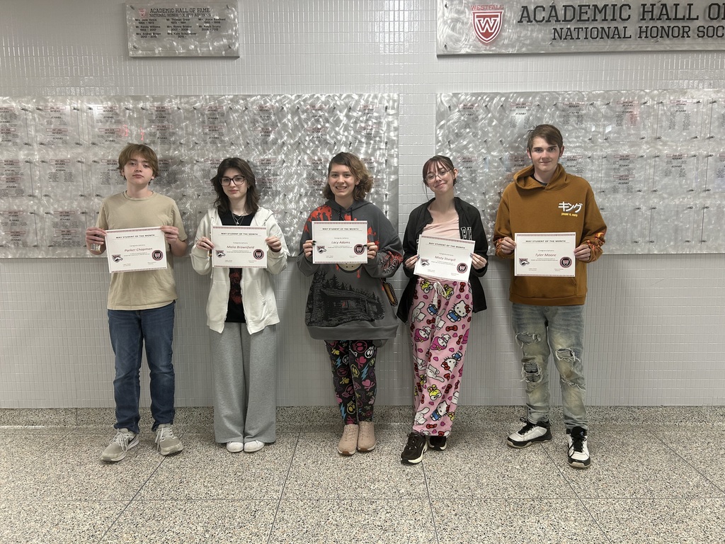 Students of the Month posing with certificates