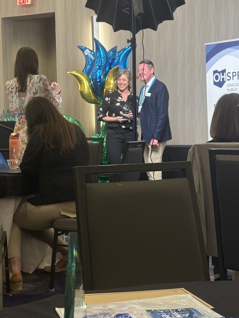 Emily Clark receiving her Mark of Distinction Award from OHSPRA representative
