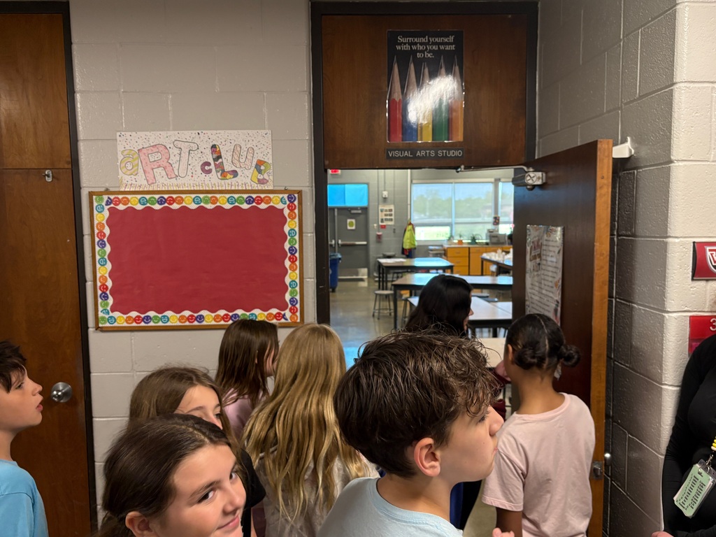 Students looking into the art room
