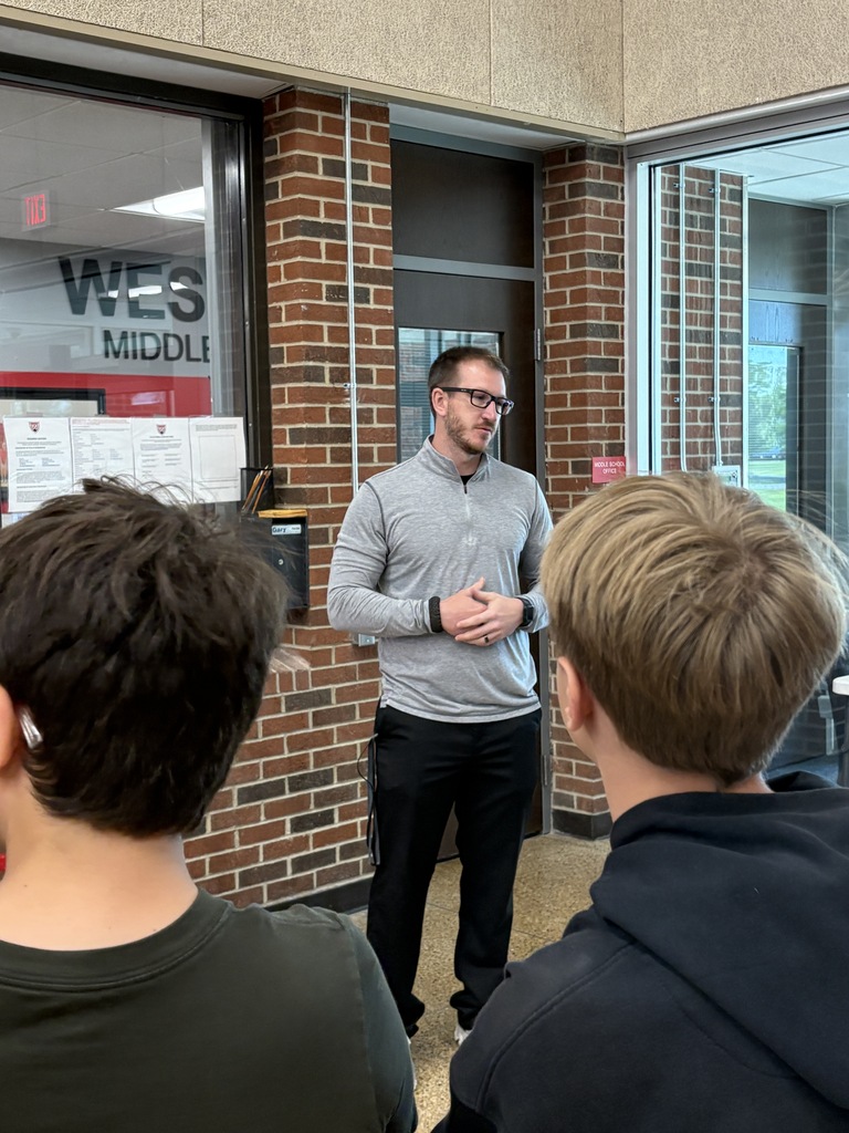 Mr. Pavey talking to students