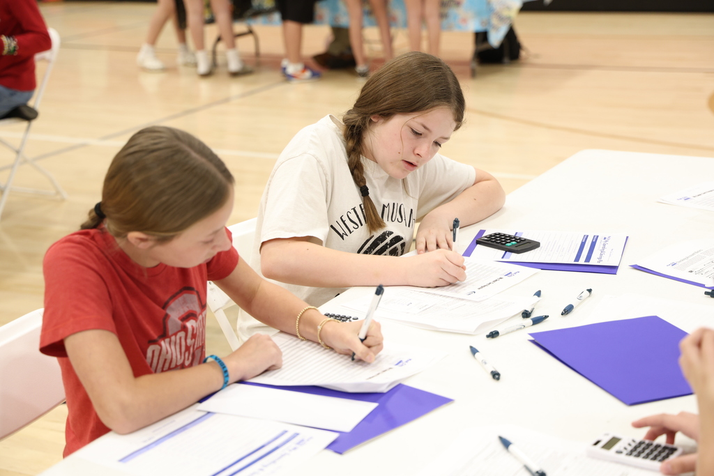 Students participating in Mad City Money simulation in the MAC gymnasium