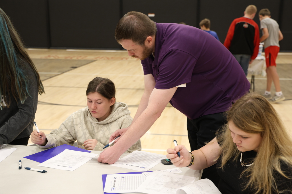 Students participating in Mad City Money simulation in the MAC gymnasium