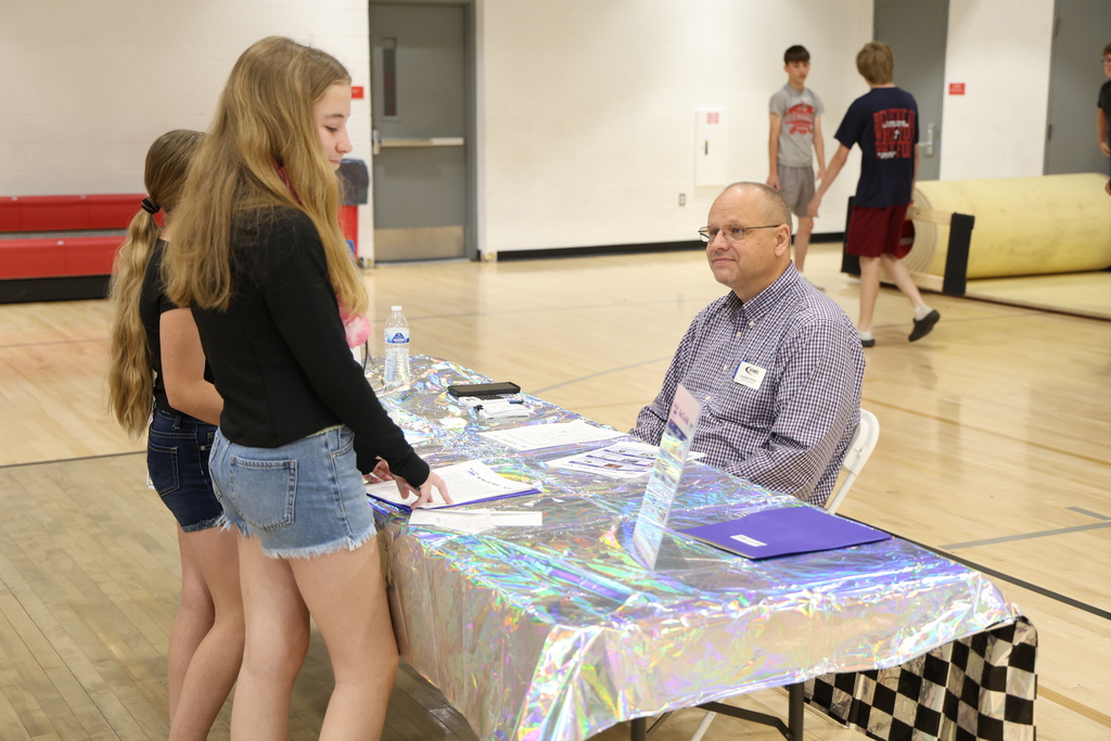 Students participating in Mad City Money simulation in the MAC gymnasium