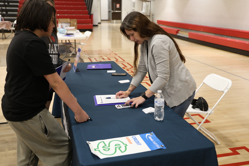 Students participating in Mad City Money simulation in the MAC gymnasium