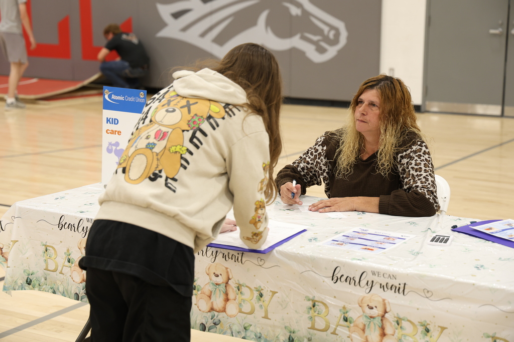 Students participating in Mad City Money simulation in the MAC gymnasium
