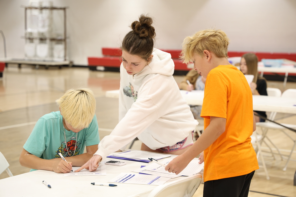 Students participating in Mad City Money simulation in the MAC gymnasium