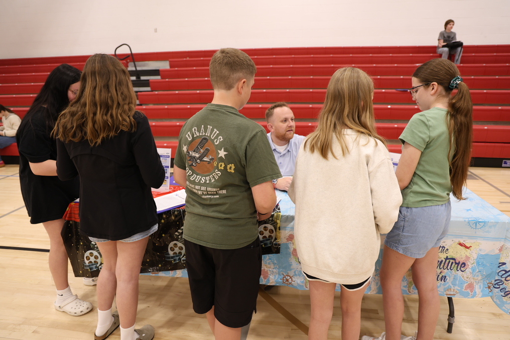 Students participating in Mad City Money simulation in the MAC gymnasium