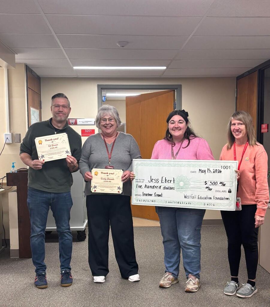 Middle School Teachers posing with certificates