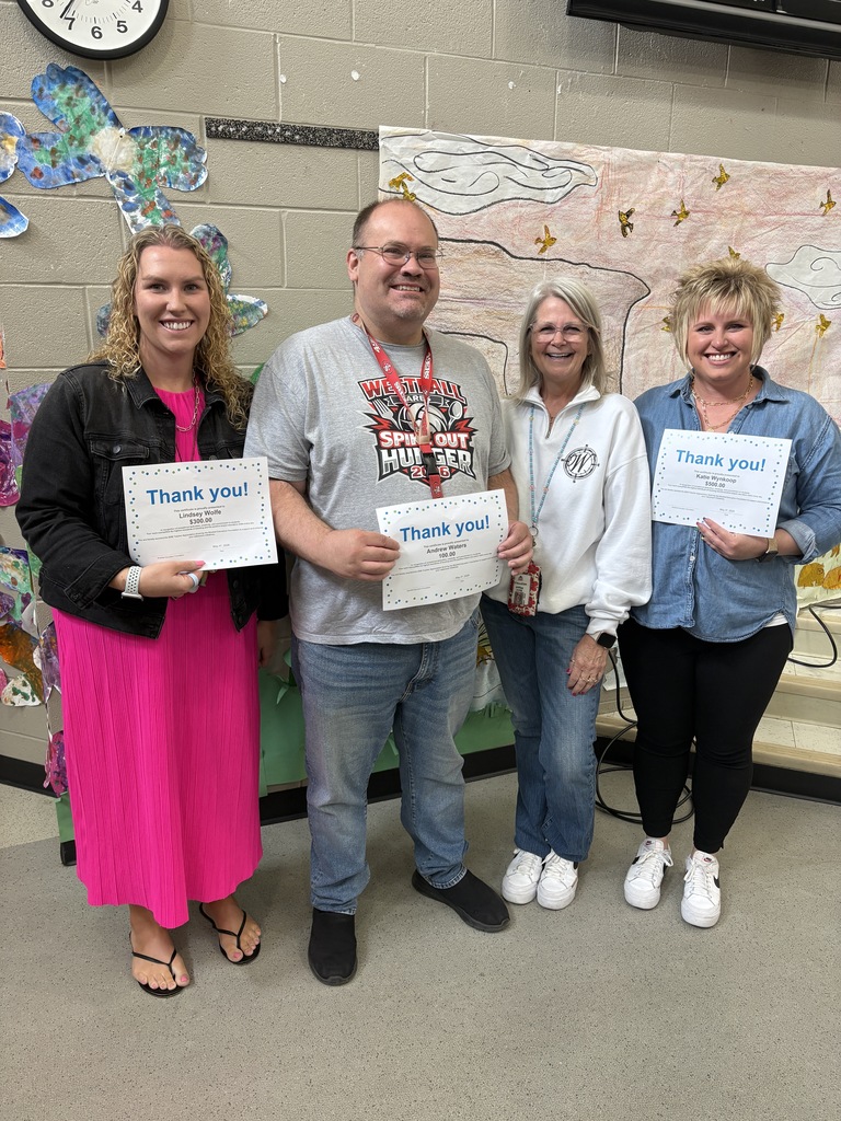 Elementary Teachers posing with certificates