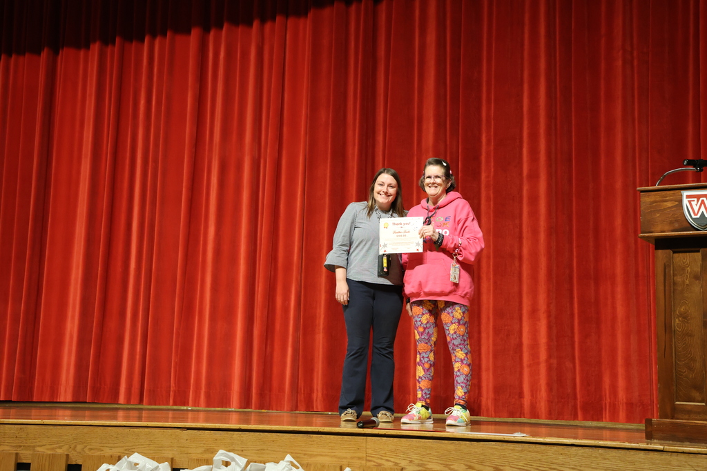 High School Teachers posing with certificate