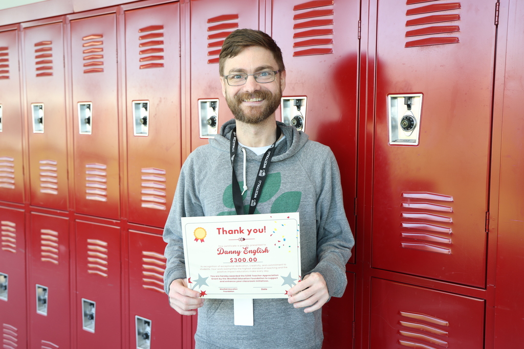 High School Teacher posing with certificate