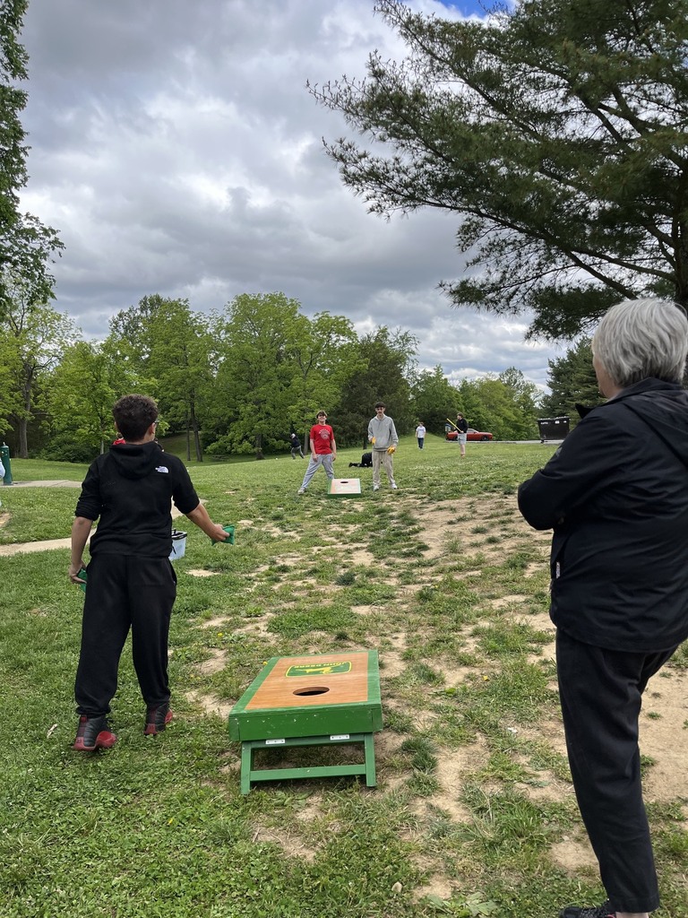 Students playing cornhole