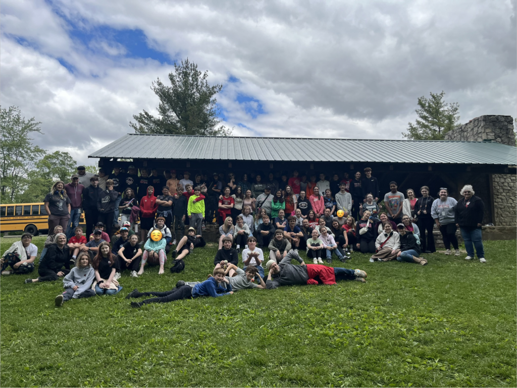 Student group photo in front of shelter house
