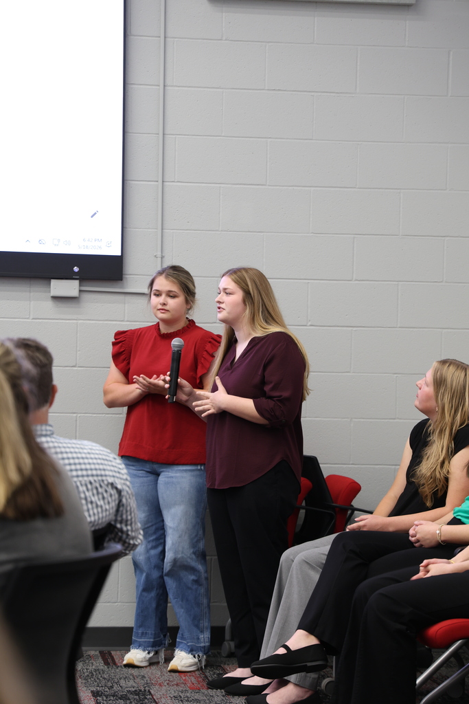 NHS Officer speaking into a microphone