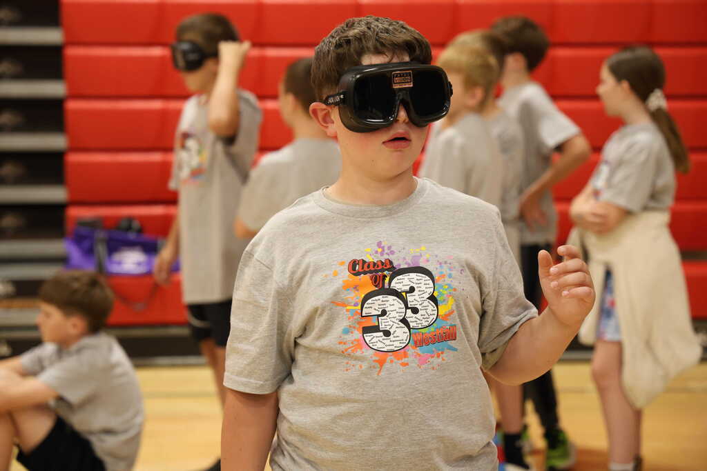 Student wearing impairment googles
