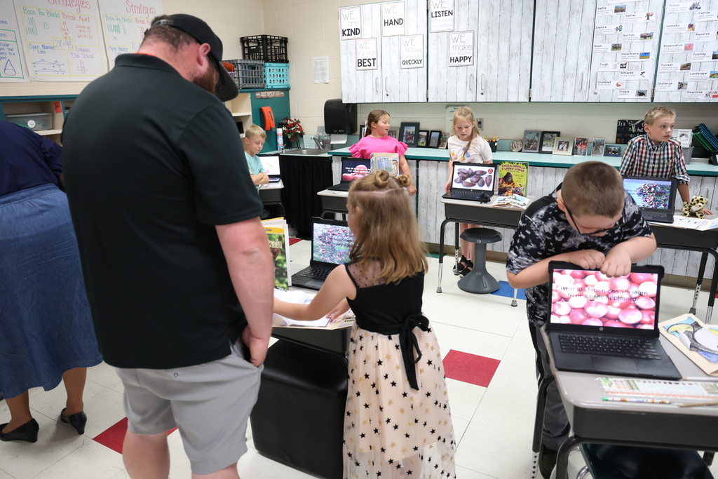 Student presenting their project to a guest