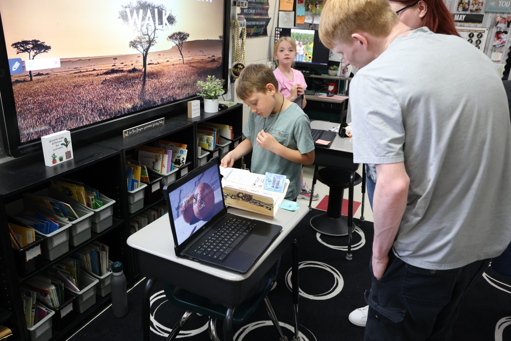 Student presenting their project to a guest