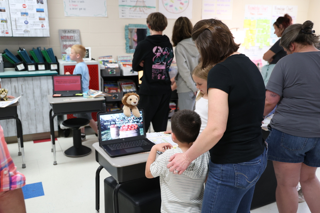Student presenting their project to a guest