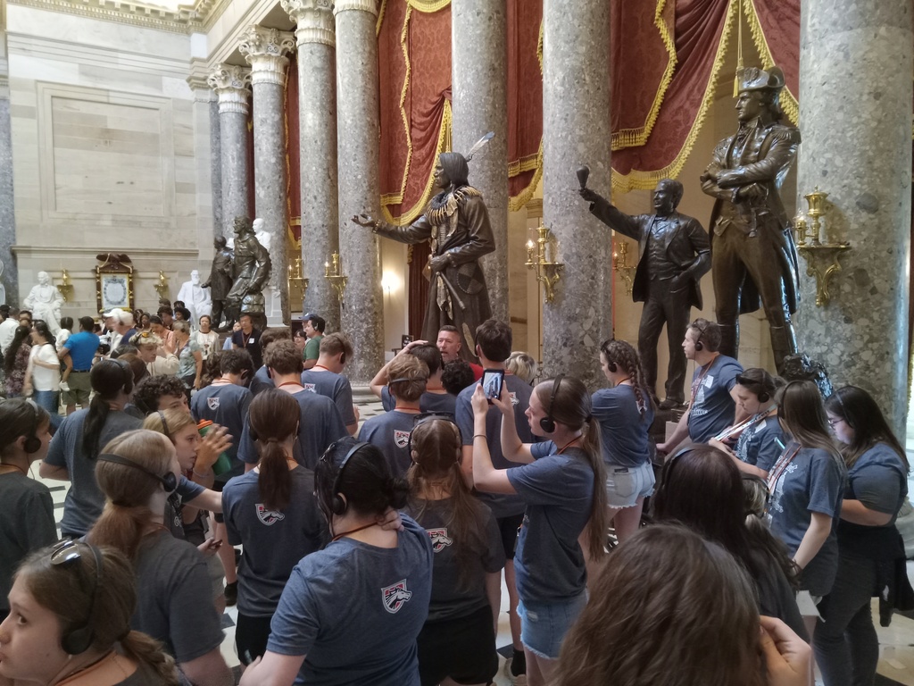 Students listening to tour guide