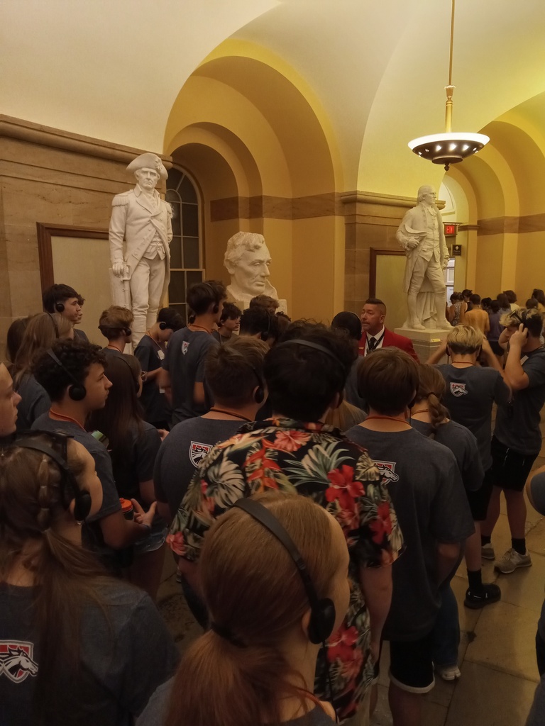 Students listening to tour guide
