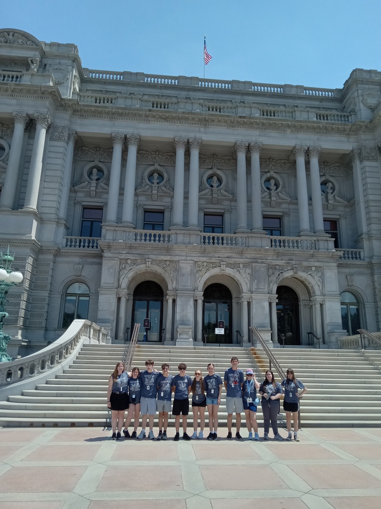 Students standing in front of building