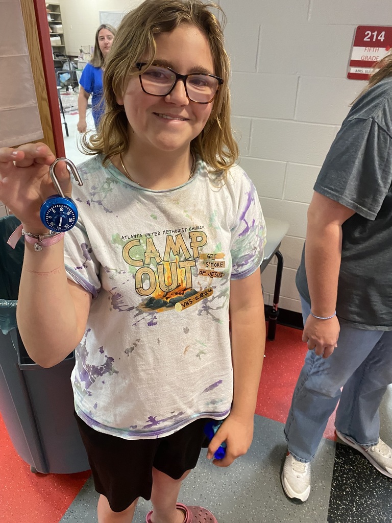 Student celebrating that she got her combo lock open