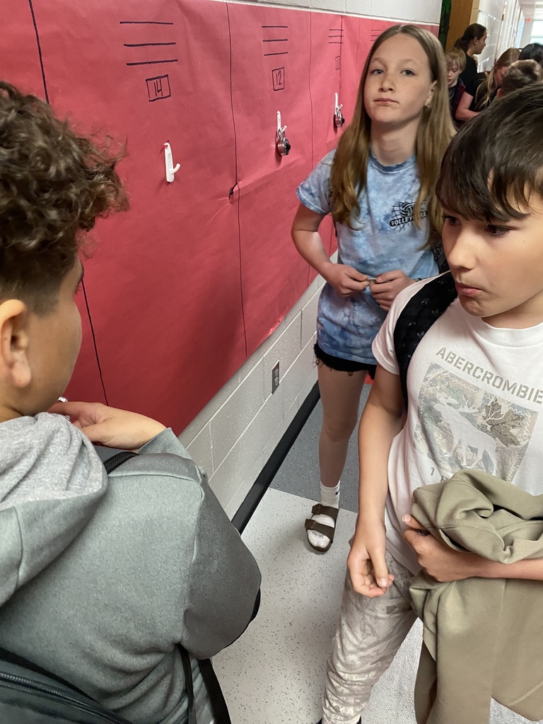 Student working on opening combo lock