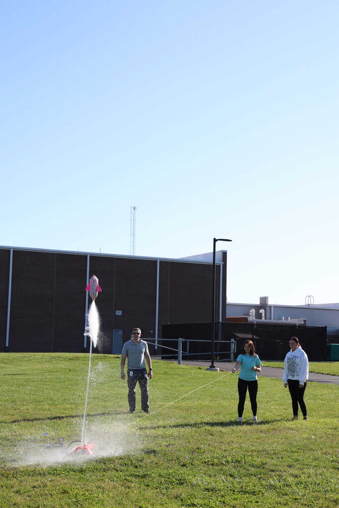 students launching bottle rockets