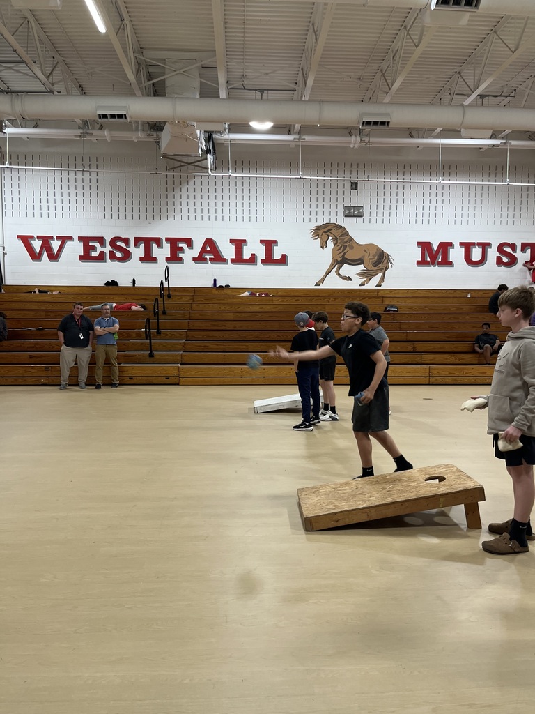 Kids playing cornhole