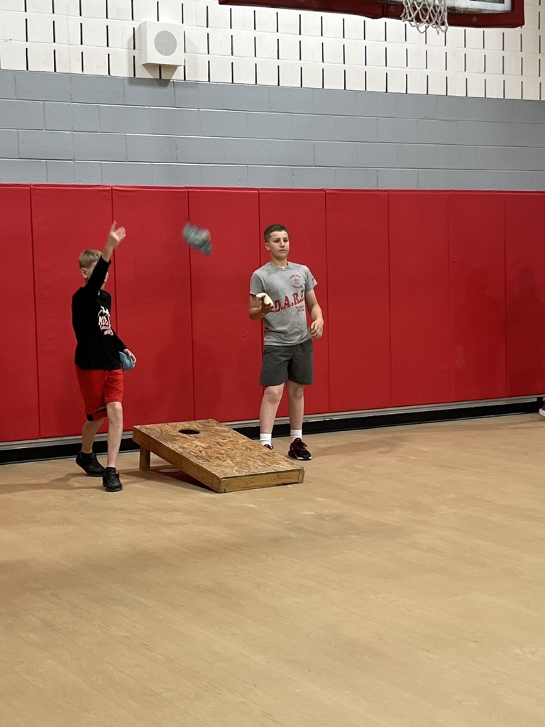 Kids playing cornhole
