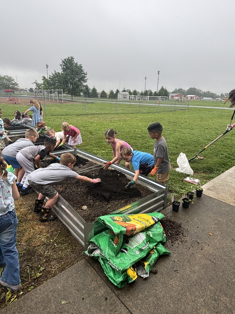 Students working in a raised garden