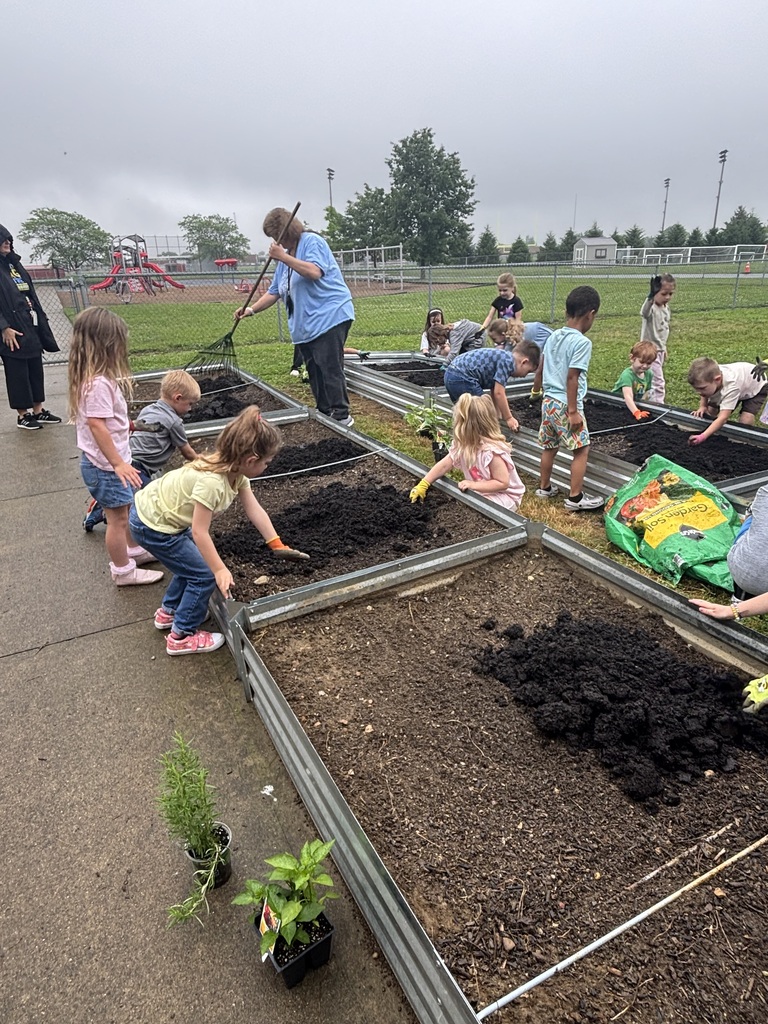 Students working in a raised garden
