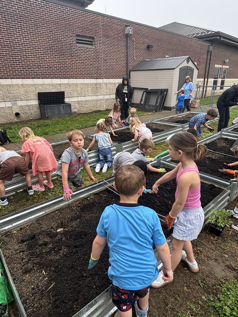 Students working in a raised garden