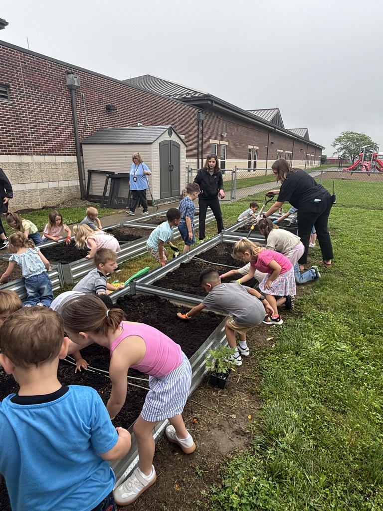 Students working in a raised garden