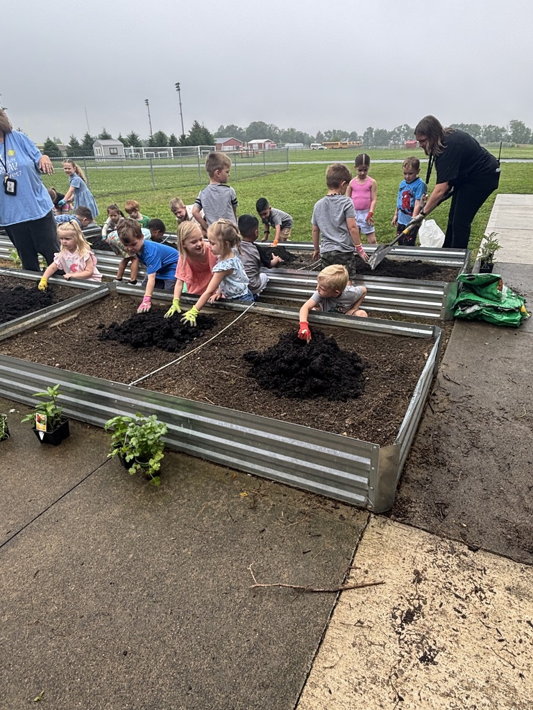 Students working in a raised garden