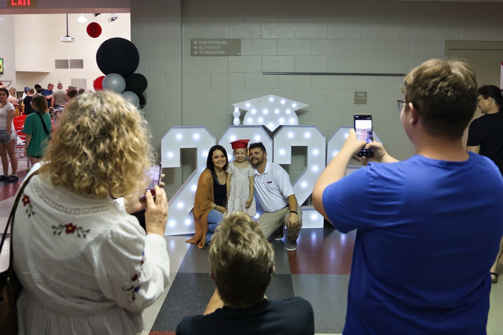 family posing for photo together