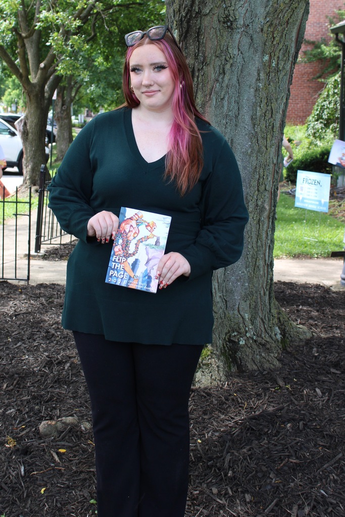 Evelyn Harrod holding the book, Flip the Page