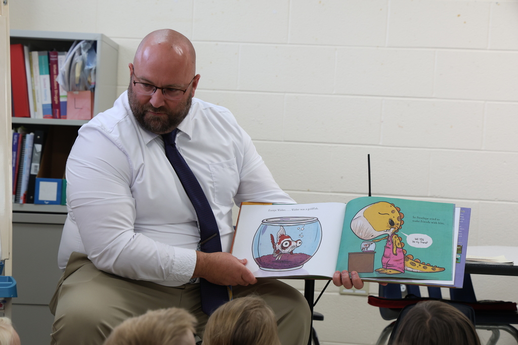 Mr. Pentiuk reading a story book